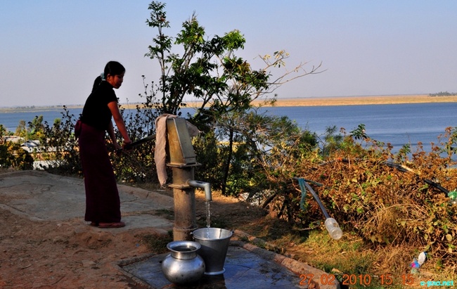  Collecting water from a Hand pump near  Loktak Lake :: Februray 2010  