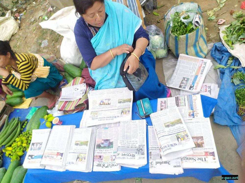 Women sellling Newspapers in the morning at Khwairamband Keithel :: 10th June 2023